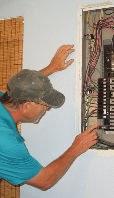 Brian inspecting electrical
