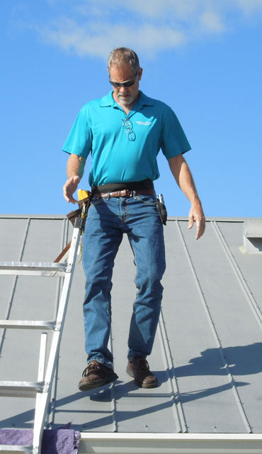 Brian inspecting a roof